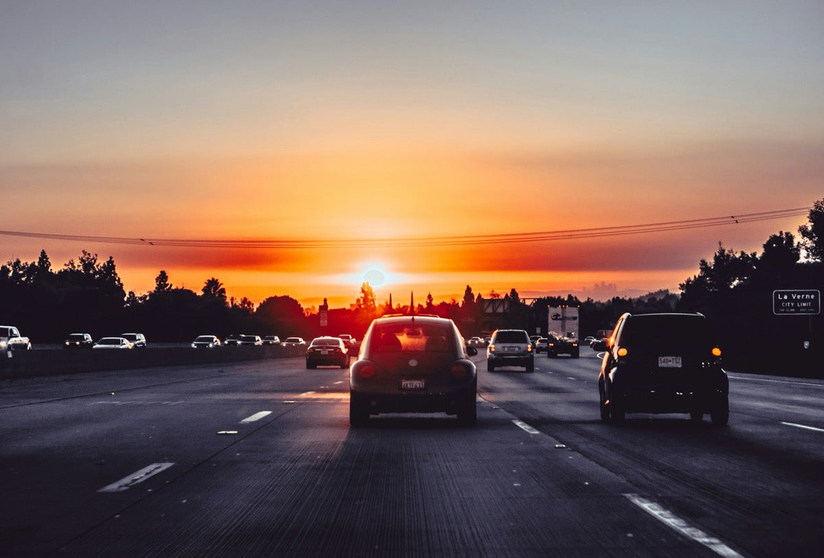 Traffic on a Michigan highway at sunset
